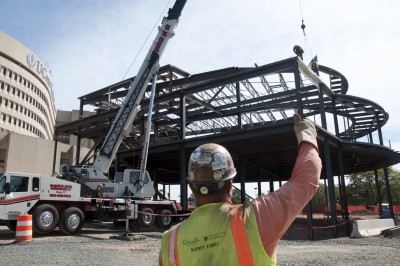 The final beam is in place atop the expanded UConn Health academic building. (Janine Gelineau/UConn Health)