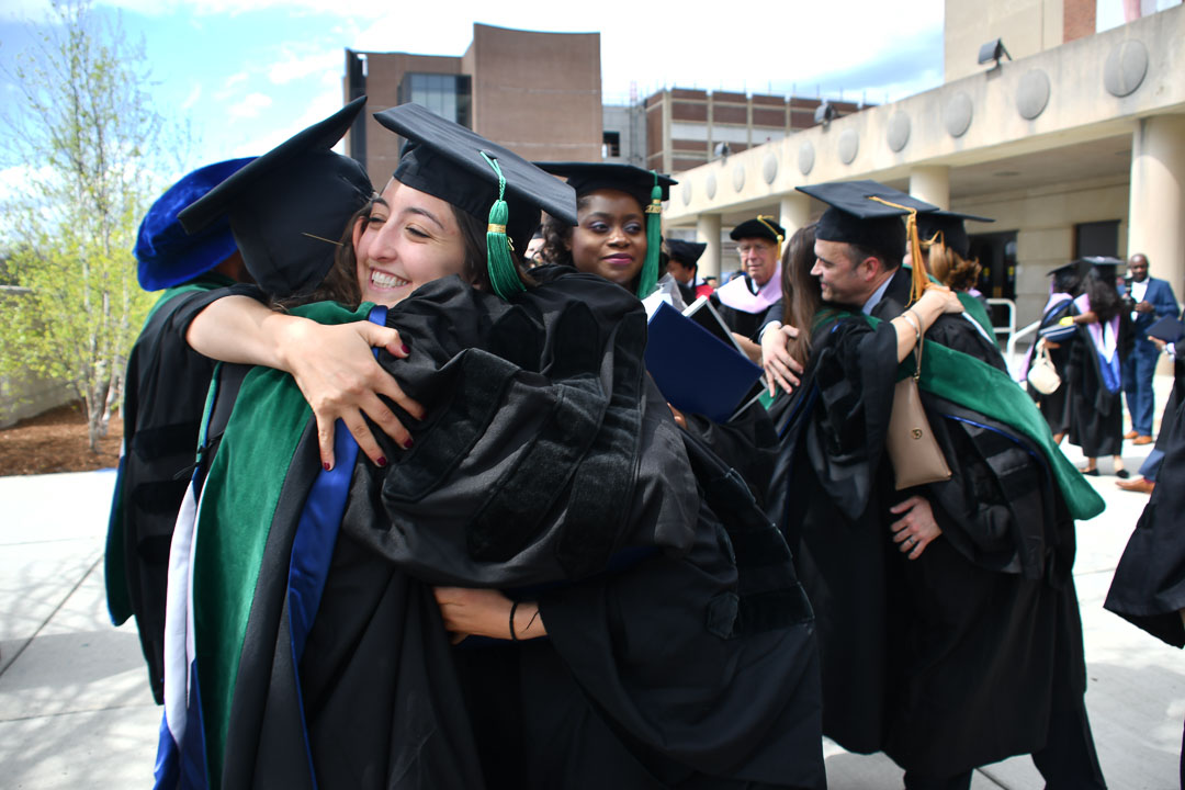 UConn School of Medicine graduates celebrate outside of the Jorgensen Center for the Performing Arts