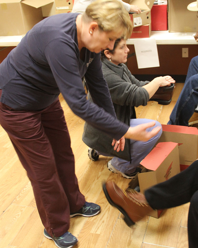 Kathleen York, Lori Engengrro providing shoes