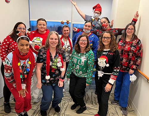 Staff in holiday sweaters