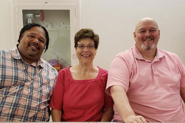 Group portraits, wearing pink shirts
